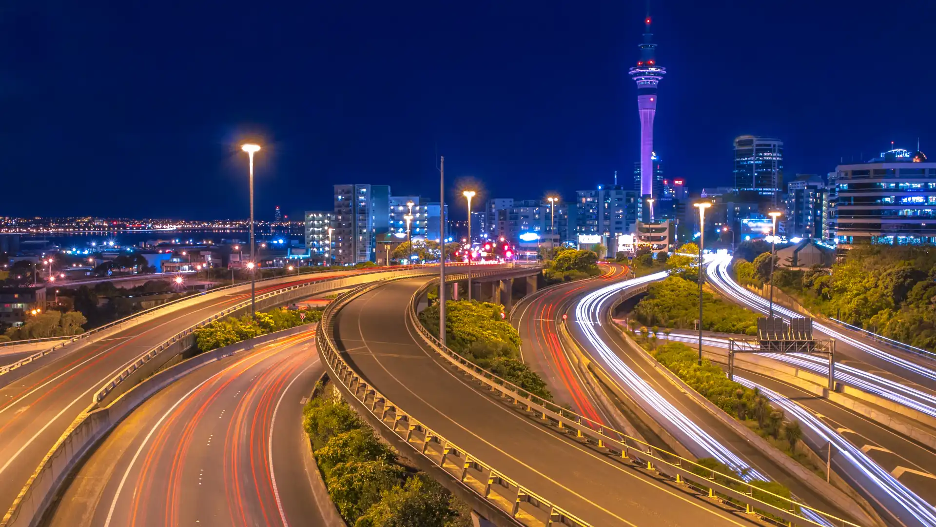 Urban lighting design - Auckland motorways at night with city in the background 