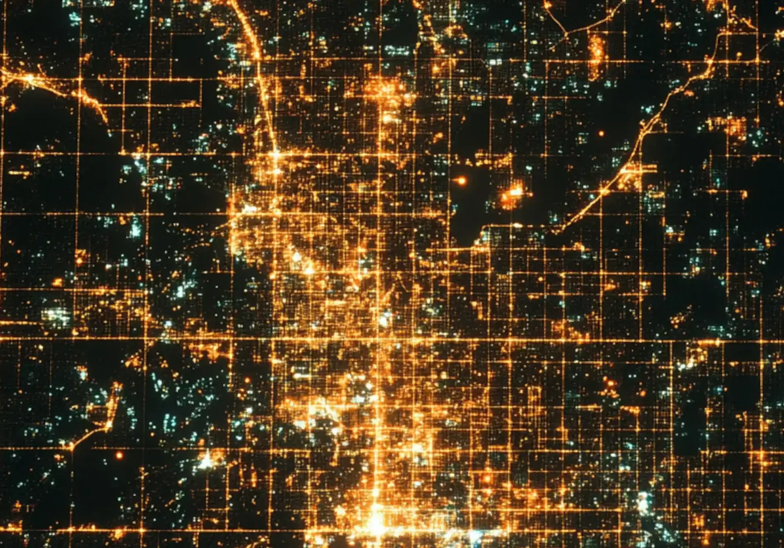 Light pollution - Aerial view of a large city lit up at night