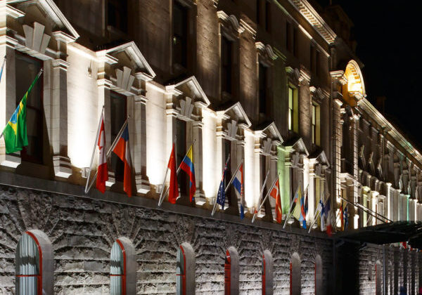 Lighting in architecture – Auckland Town Hall at night with flags