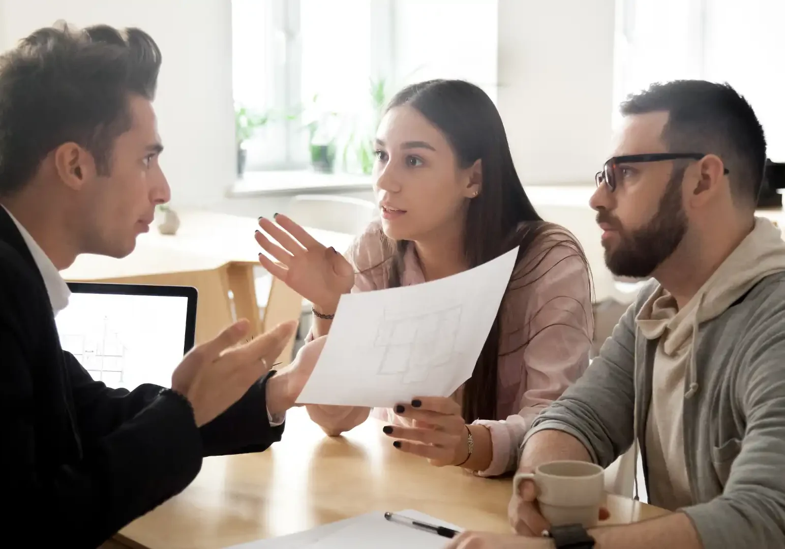 Lighting disputes - A couple arguing with someone at a desk